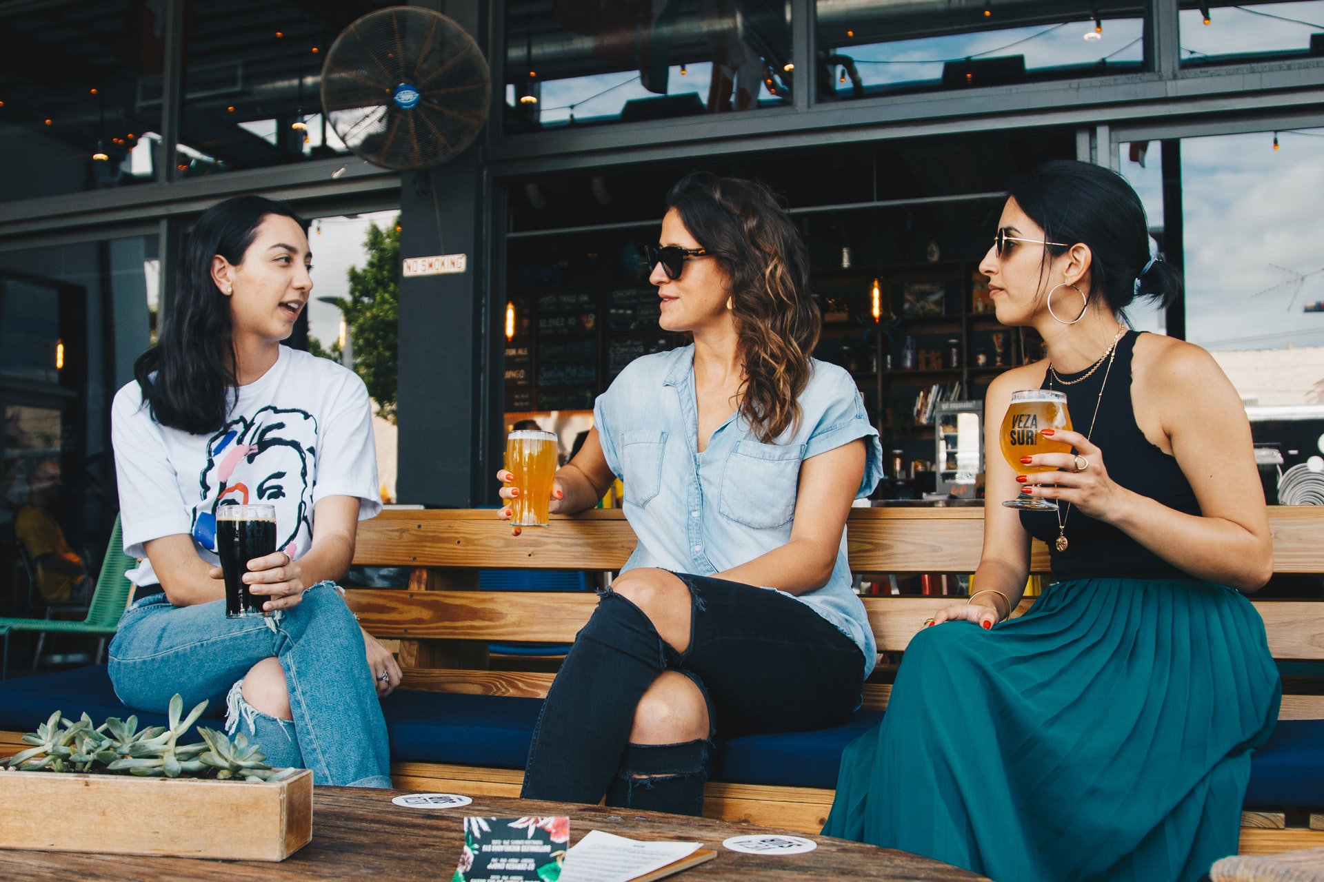 three friends eating at a Houston restaurant