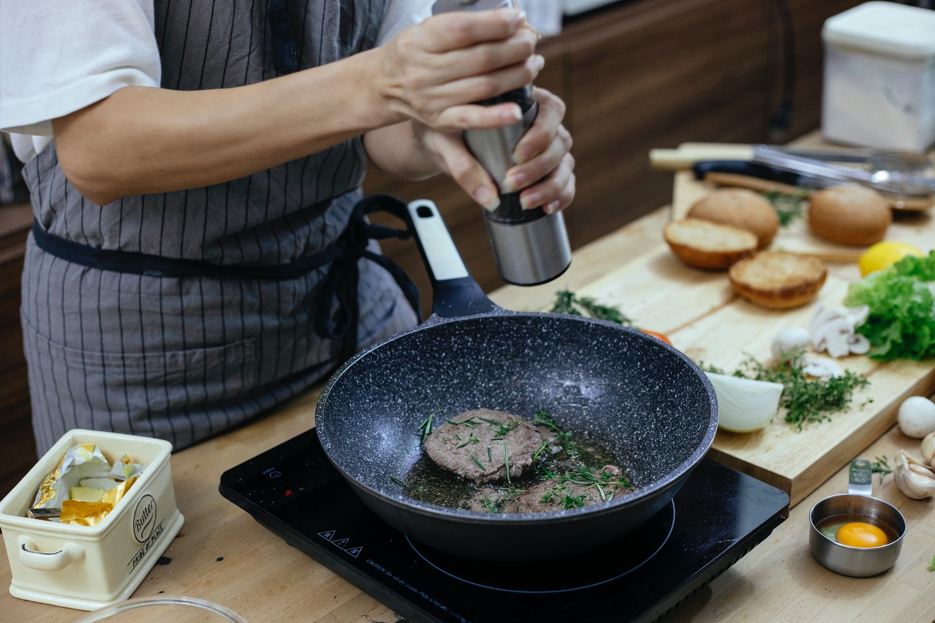 person cooking in their RPM Living San Antonio apartment