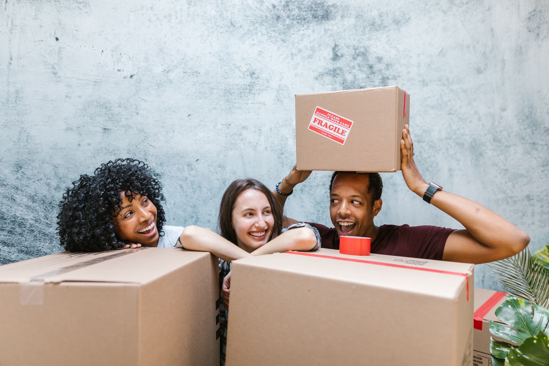 roommates moving into apartment with boxes