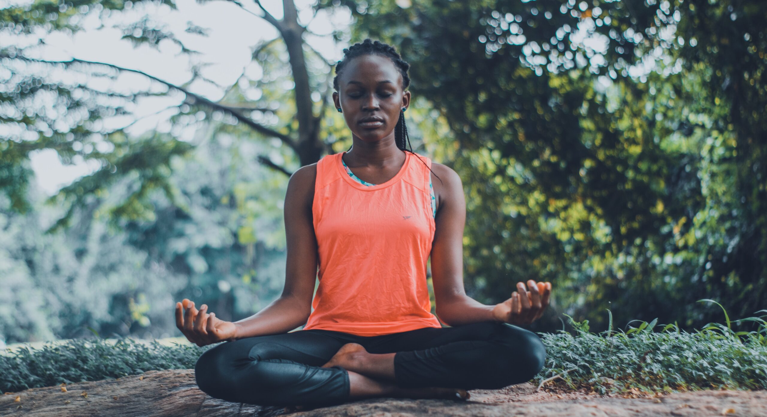 woman meditating outdoors