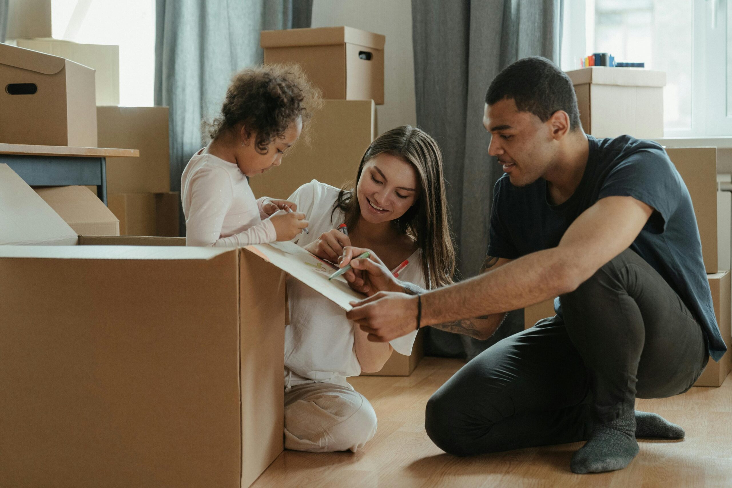 new apartment checklist rpm living blog family unpacking boxes in new apartment