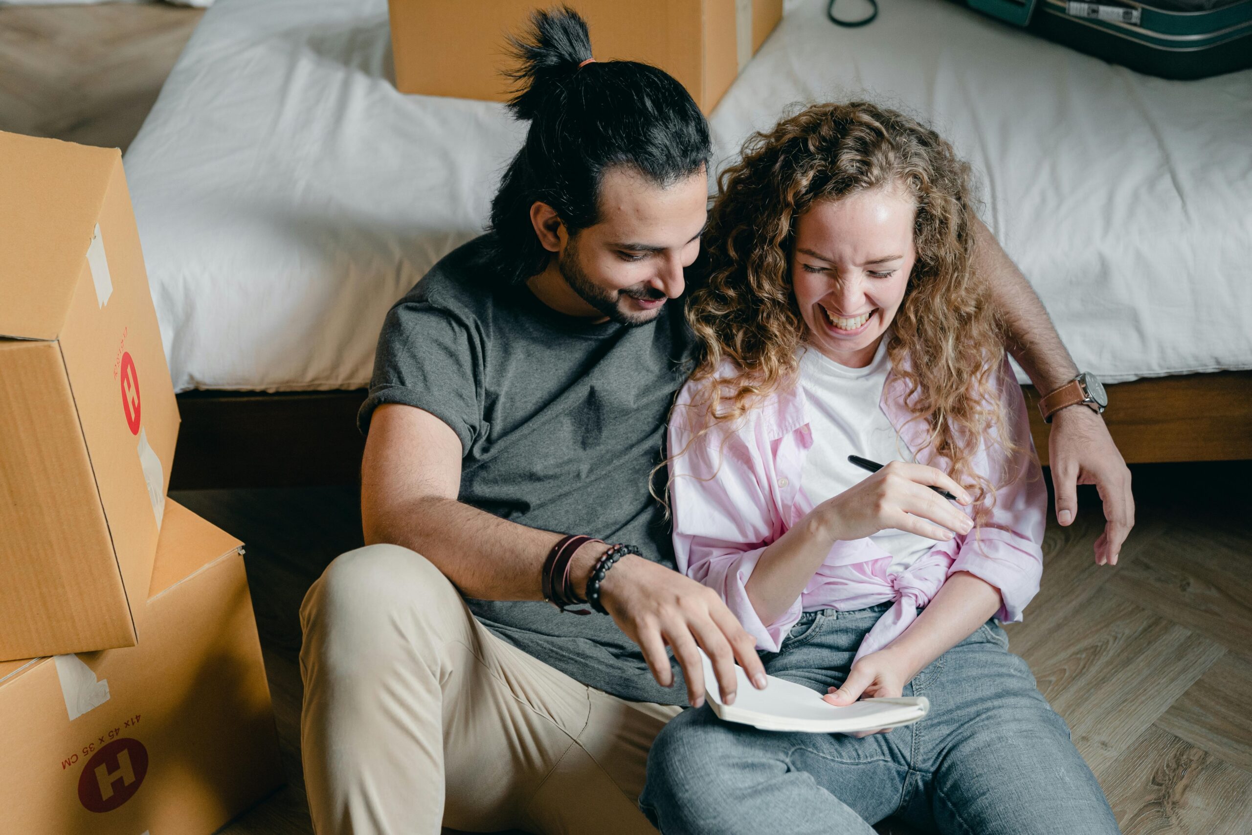 Young couple checking their apartment move-in list - RPM Living